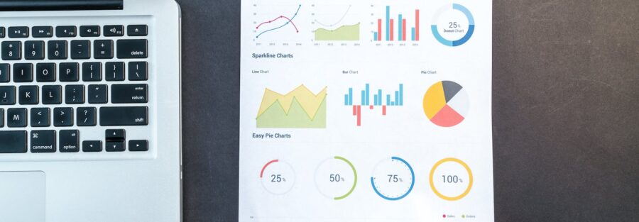 person holding chart and bar graph